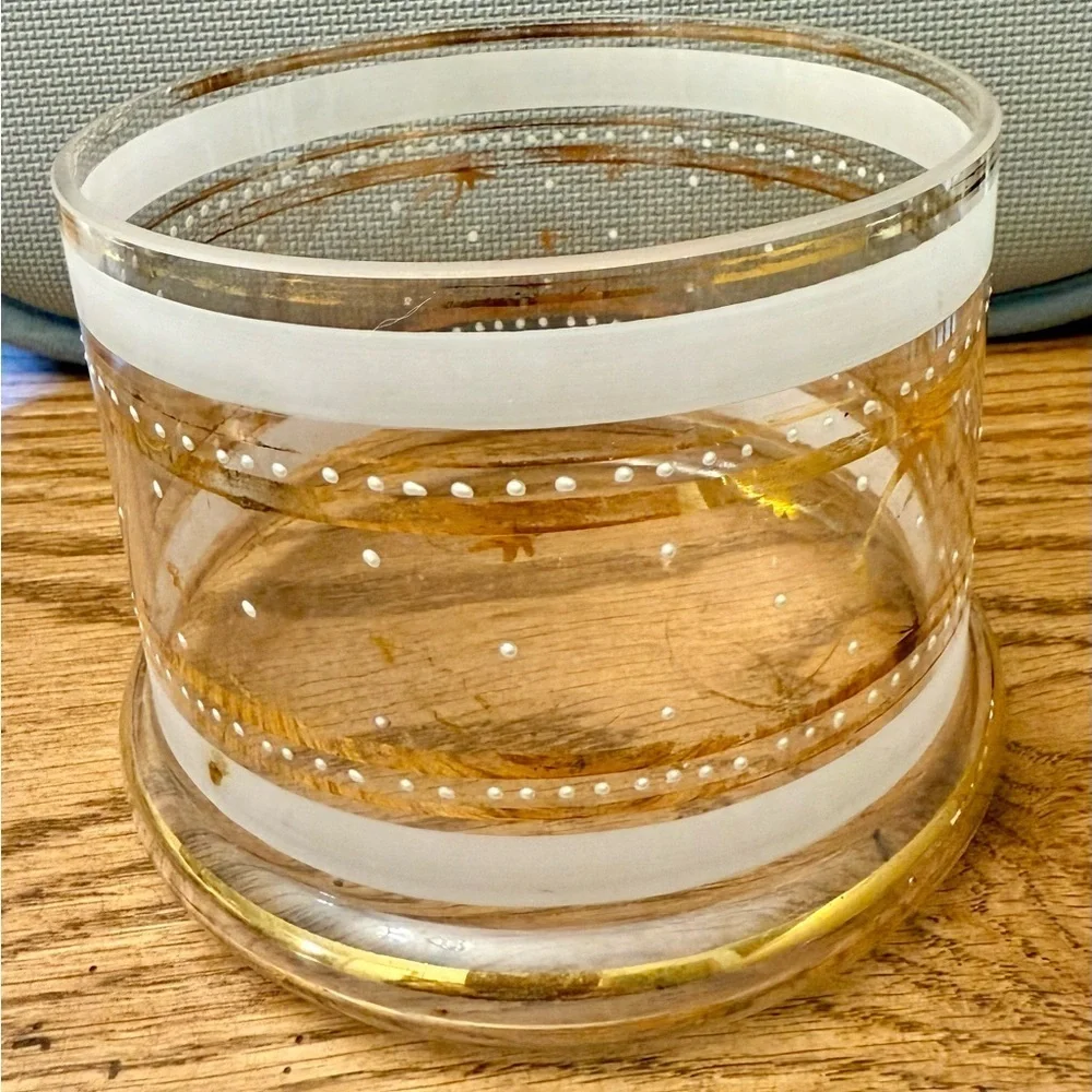 Elegant mid-century clear and frosted glass jar with gold accents.